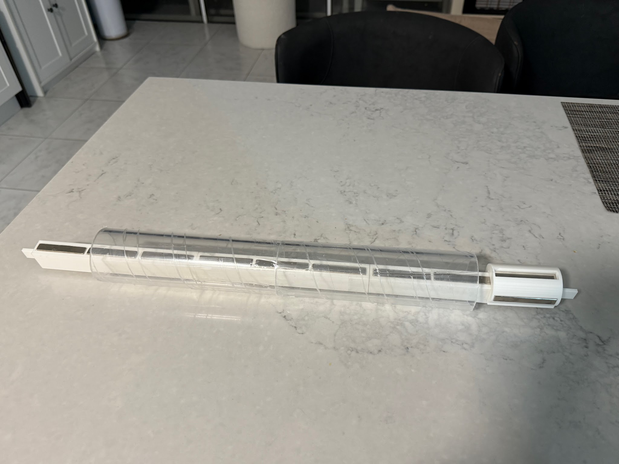 The assembled mini hyperloop maglev train kit on its test track